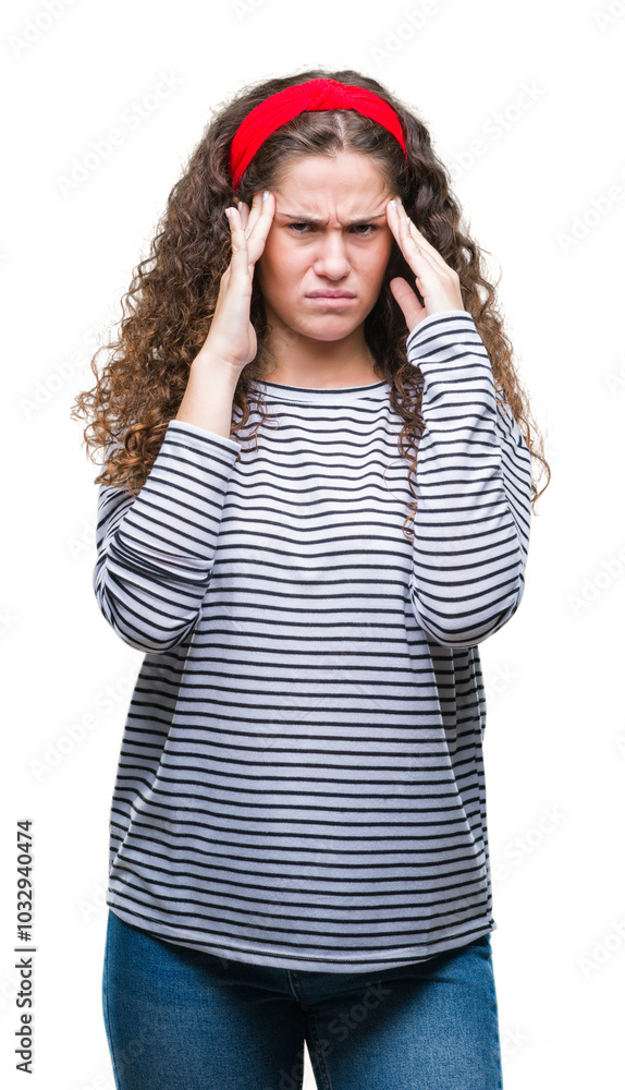 Beautiful brunette curly hair young girl wearing stripes sweater over isolated background with hand on head for pain in head because stress. Suffering migraine.