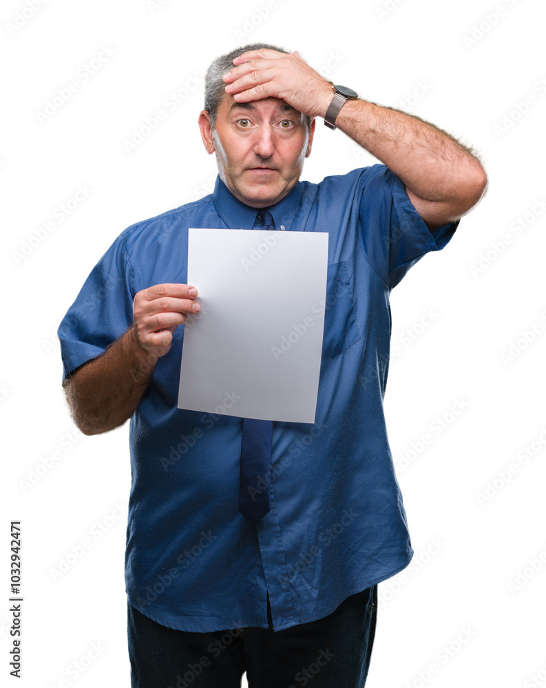 Handsome senior man holding blank sheet paper over isolated background stressed with hand on head, shocked with shame and surprise face, angry and frustrated. Fear and upset for mistake. Handsome senior man holding blank sheet paper over isolated background stressed with hand on head, shocked with shame and surprise face, angry and frustrated. Fear and upset for mistake.