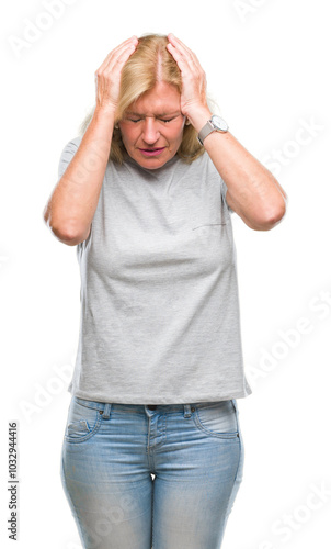 Obraz na plátně Middle age blonde woman over isolated background suffering from headache desperate and stressed because pain and migraine