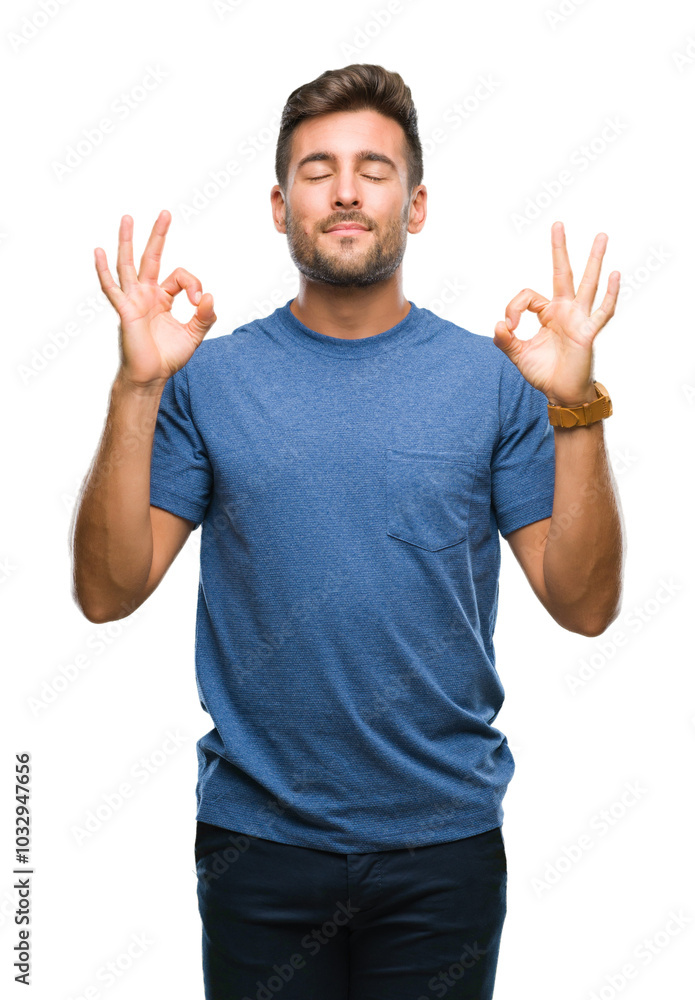 Fototapeta premium Young handsome man over isolated background relax and smiling with eyes closed doing meditation gesture with fingers. Yoga concept.