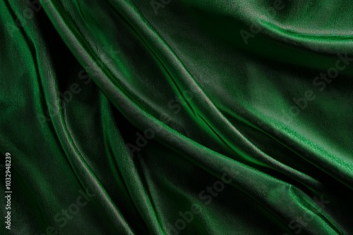 A green fabric with a shiny texture