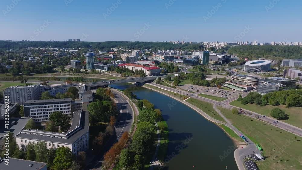 Aerial view of Vilnius, Lithuania, featuring the Vilnius TV Tower, Neris River, and a mix of modern and historical architecture. Aerial view of Vilnius, Lithuania, featuring the Vilnius TV Tower, Neris River, and a mix of modern and historical architecture.