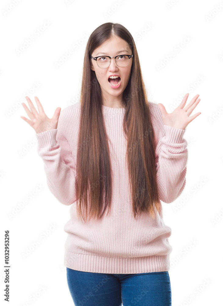 Φωτογραφία Young Chinese woman over isolated background wearing glasses crazy and mad shouting and yelling with aggressive expression and arms raised