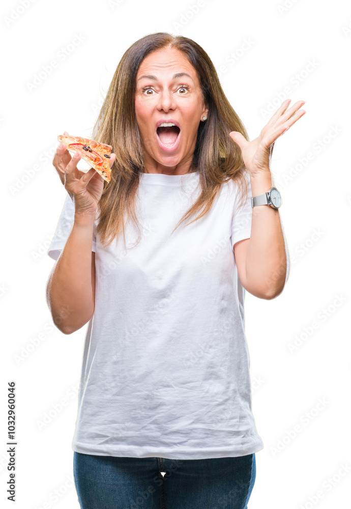 Middle age hispanic woman eating pizza slice over isolated background very happy and excited, winner expression celebrating victory screaming with big smile and raised hands Middle age hispanic woman eating pizza slice over isolated background very happy and excited, winner expression celebrating victory screaming with big smile and raised hands