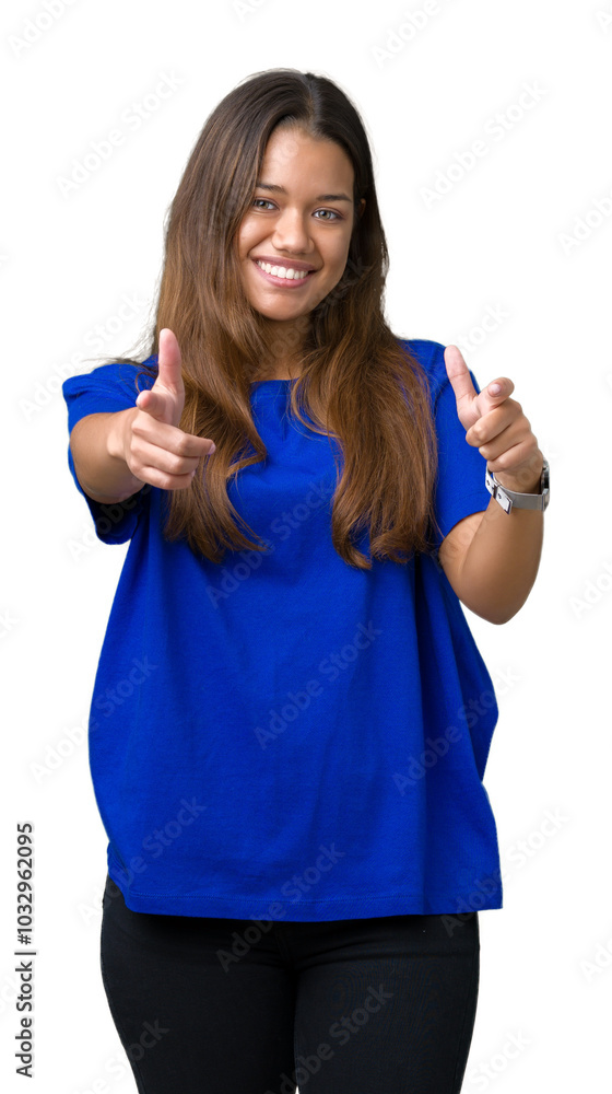 Young beautiful brunette woman wearing blue t-shirt over isolated background pointing fingers to camera with happy and funny face. Good energy and vibes. Young beautiful brunette woman wearing blue t-shirt over isolated background pointing fingers to camera with happy and funny face. Good energy and vibes.