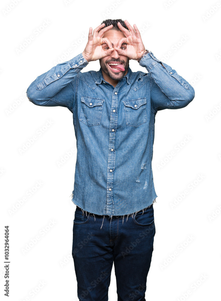 Young handsome man over isolated background doing ok gesture like binoculars sticking tongue out, eyes looking through fingers. Crazy expression. Young handsome man over isolated background doing ok gesture like binoculars sticking tongue out, eyes looking through fingers. Crazy expression.