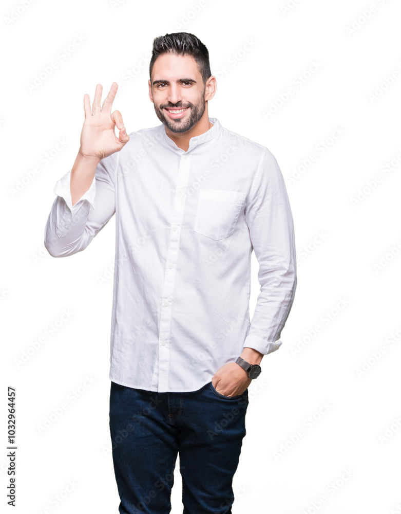 Young business man over isolated background smiling positive doing ok sign with hand and fingers. Successful expression. Young business man over isolated background smiling positive doing ok sign with hand and fingers. Successful expression.