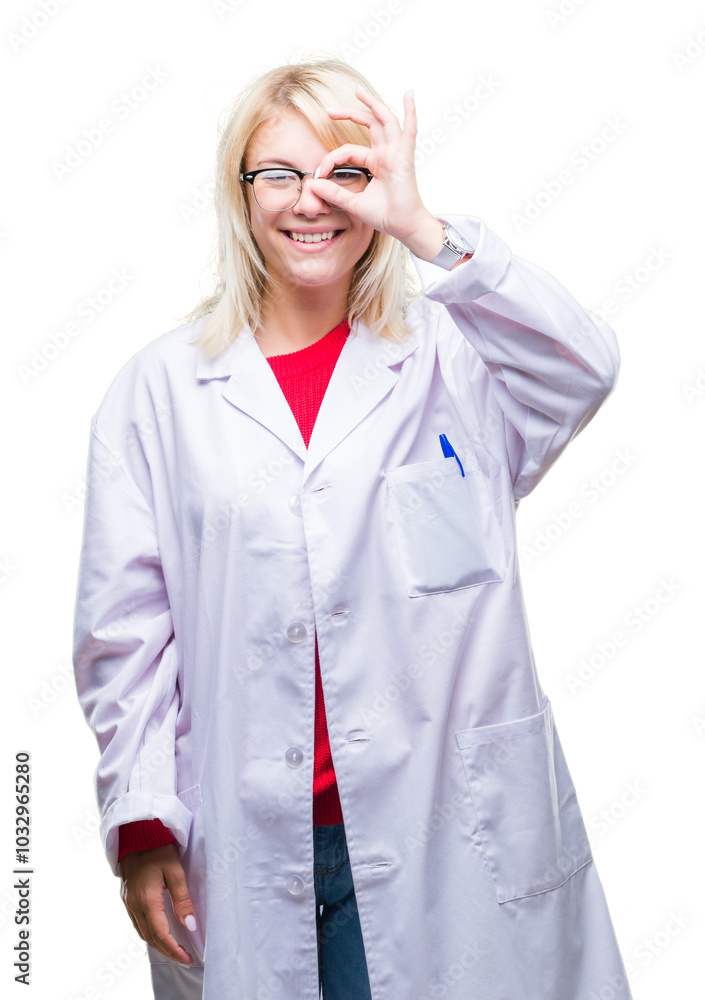 Young beautiful blonde professional woman wearing white coat over isolated background doing ok gesture with hand smiling, eye looking through fingers with happy face. Young beautiful blonde professional woman wearing white coat over isolated background doing ok gesture with hand smiling, eye looking through fingers with happy face.