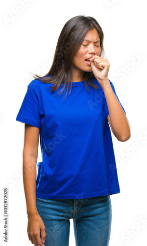 Young asian woman over isolated background feeling unwell and coughing as symptom for cold or bronchitis. Healthcare concept.