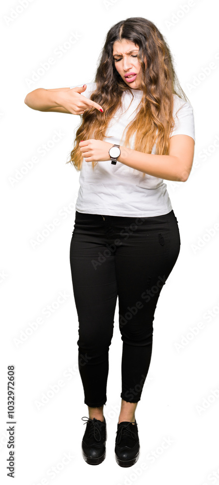 Young beautiful woman wearing casual white t-shirt In hurry pointing to watch time, impatience, upset and angry for deadline delay Young beautiful woman wearing casual white t-shirt In hurry pointing to watch time, impatience, upset and angry for deadline delay