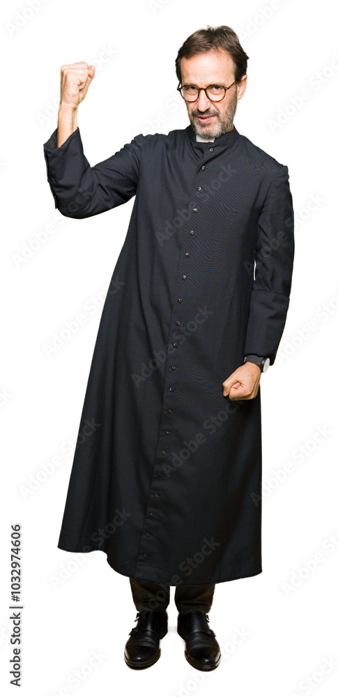 Middle age priest man wearing catholic robe Strong person showing arm muscle, confident and proud of power Middle age priest man wearing catholic robe Strong person showing arm muscle, confident and proud of power