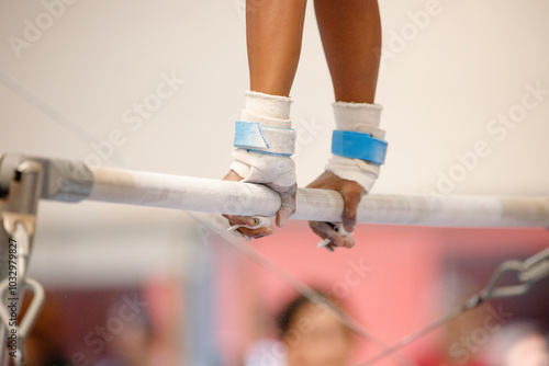 gymnast on the uneven bars during an artistic gymnastics training session in Rio de Janeiro.