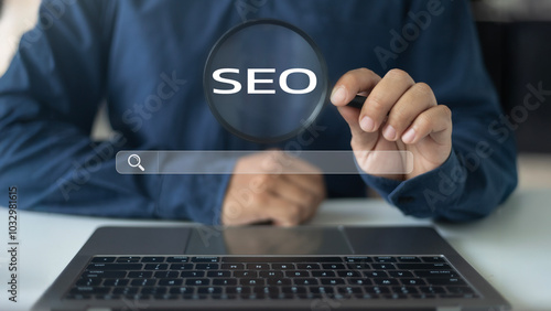 Businessman analyzing SEO with a magnifying glass to improve website ranking and drive more traffic through search engine optimization strategies.