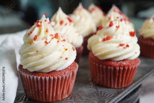 Red velvet cupcakes with rich vanilla buttercream frosting. photo