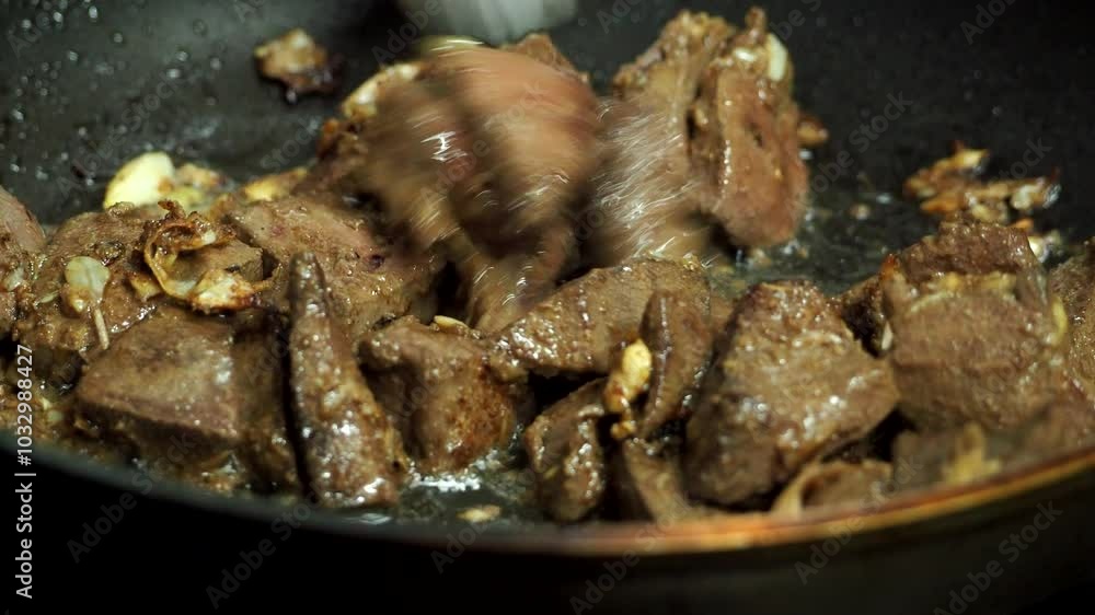 Frying pork liver in pan, in door Chiangmai Thailand Frying pork liver in pan, in door Chiangmai Thailand