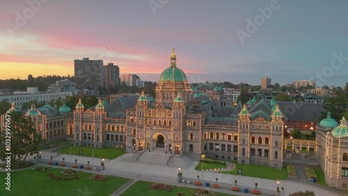 Victoria, British Columbia, Canada. October 05, 2024: Drone perspective of the British Columbia Parliament Building at dusk, illuminated by string lights