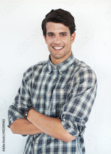 Creative, studio and portrait of happy man with confidence, professional pride and casual fashion style. Businessman, designer or consultant with pride, arms crossed and isolated on white background