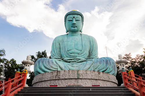 Great Buddha or Kamakura Daibutsu statue at sunset time in Wat Phra That Doi Phra Chan temple, Lampang, Thailand.