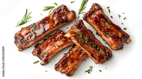 Delicious grilled pork ribs in BBQ sauce with herbs, isolated on white background. 