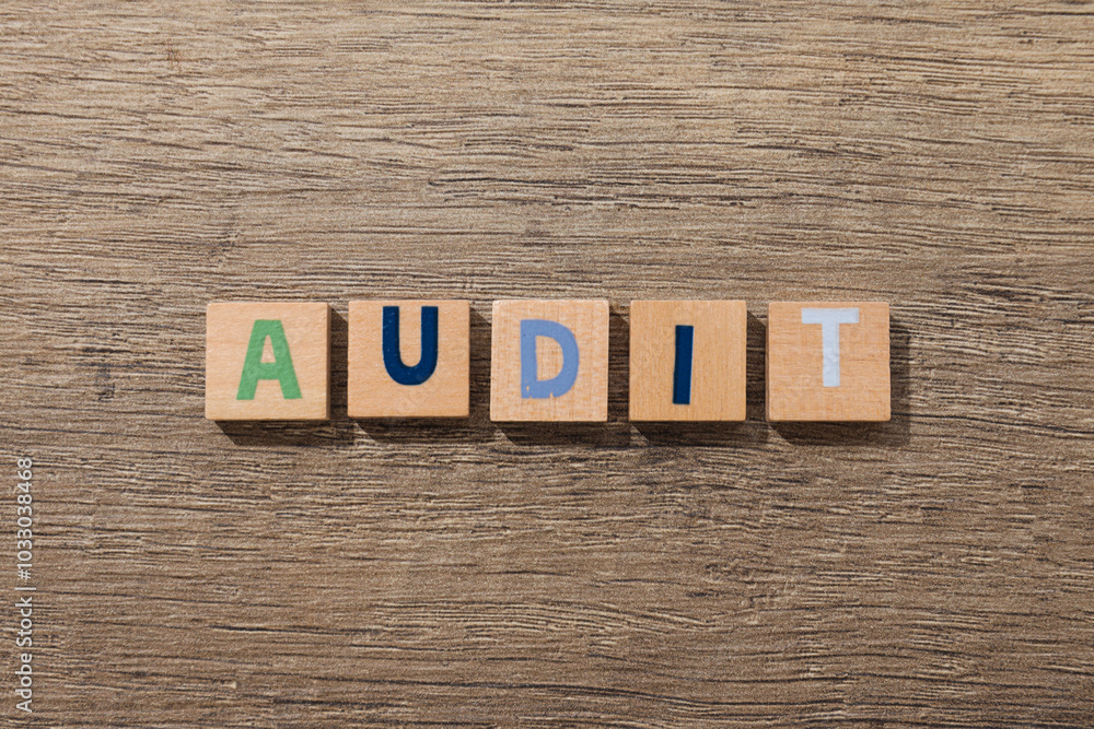 Fototapeta premium Wooden cubes with letters on wooden background, top view