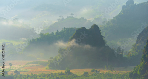 Beautiful Mountain landscape foggy windy mountain range green landscape asian farm. Amazing Landscape mountain green field meadow white cloud blue sky on sunrise. Countryside sunlight heaven scenery