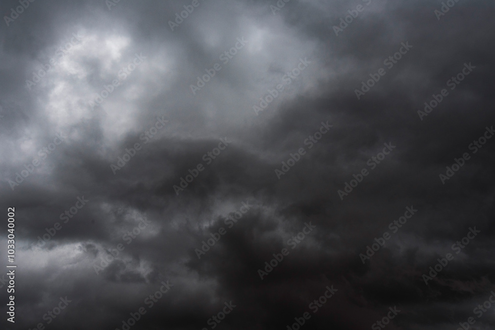 Dramatic dark storm rain clouds black sky background. Dark thunderstorm clouds rainny atmosphere. Meteorology danger windstorm disasters climate. Dark cloudscape storm disaster gloomy gray cloud sky Dramatic dark storm rain clouds black sky background. Dark thunderstorm clouds rainny atmosphere. Meteorology danger windstorm disasters climate. Dark cloudscape storm disaster gloomy gray cloud sky