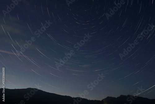 Nocturnal Mountainscape With Star Trails