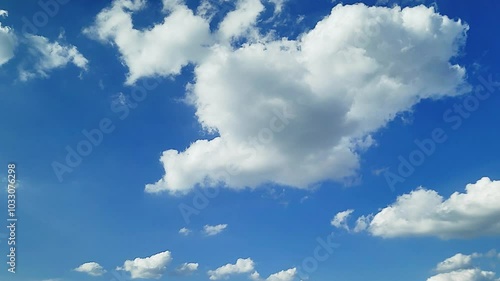 Cloudscape, a Timelapse of a beautiful blue sky with fluffy white clouds, for a background
