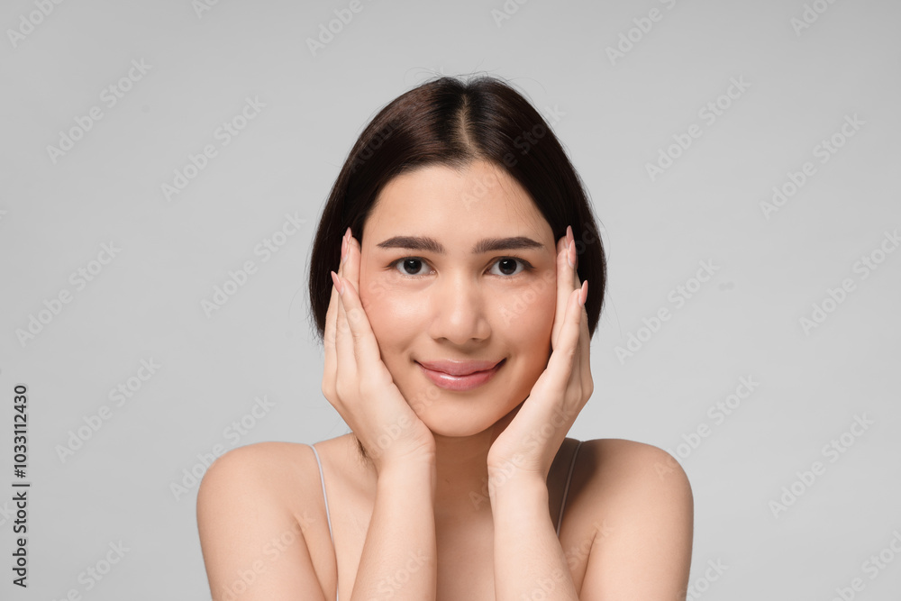 Beautiful young asian woman with clean fresh skin on face. Girl facial treatment. Cosmetology, beauty and spa. Beautiful young asian woman with clean fresh skin on face. Girl facial treatment. Cosmetology, beauty and spa.