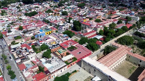 Drone aerial landscape old town square with cultural museum landmark buildings and housing streets shops and restaurants Oaxaca city Mexico travel holidays tourism photo