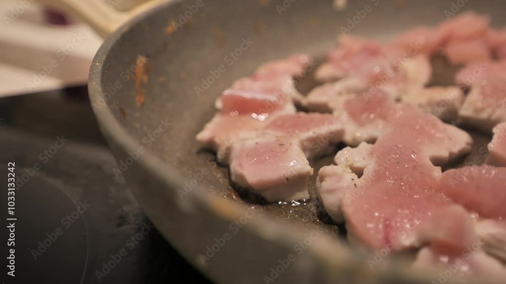Handheld camera captures the artistic frying of fillet with focus on the pan. Handheld camera captures the artistic frying of fillet with focus on the pan.