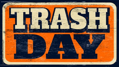 Aged and worn trash day sign on wood