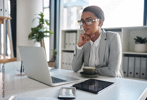 Office, businesswoman and thinking with laptop for solution, reading information and online research. Career, female person and project manager with digital for corporate, report and company progress photo