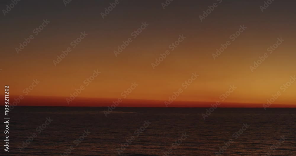 A Serene and Beautiful Sunset Over a Tranquil Ocean View That Invites Relaxation and Peacefulness A Serene and Beautiful Sunset Over a Tranquil Ocean View That Invites Relaxation and Peacefulness