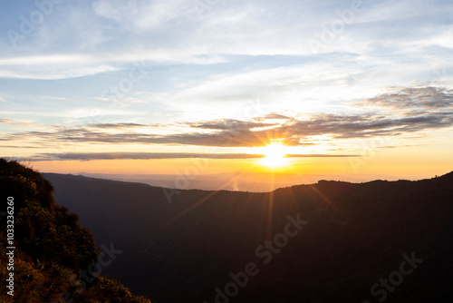 Landscape of Morning Mist with Mountain Layer at north of Thailand. mountain ridge and clouds in rural jungle bush forest