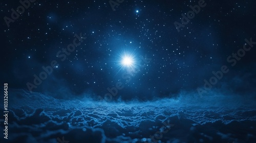 A bright, shining star illuminates the night sky over a field of clouds.