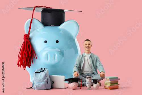 Male student sitting with p...
