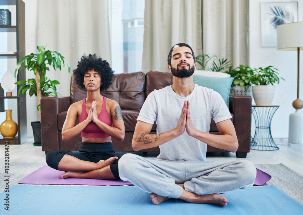 Namaste, yoga and couple in home for meditation, mindfulness exercise or prayer hands. Relax, interracial man and woman breathe for peace, calm or spiritual wellness for body health, zen or fitness Namaste, yoga and couple in home for meditation, mindfulness exercise or prayer hands. Relax, interracial man and woman breathe for peace, calm or spiritual wellness for body health, zen or fitness