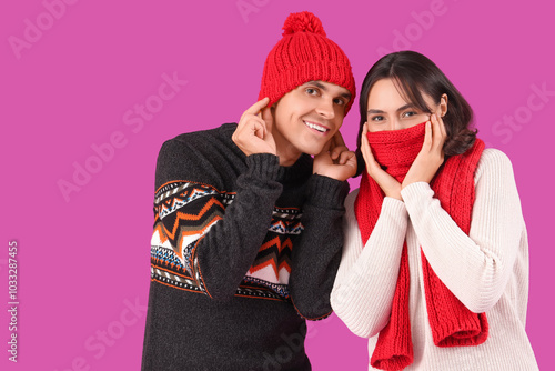 Happy young couple in warm ...