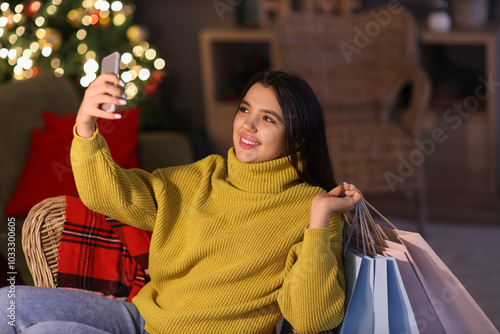 Young woman with mobile pho...