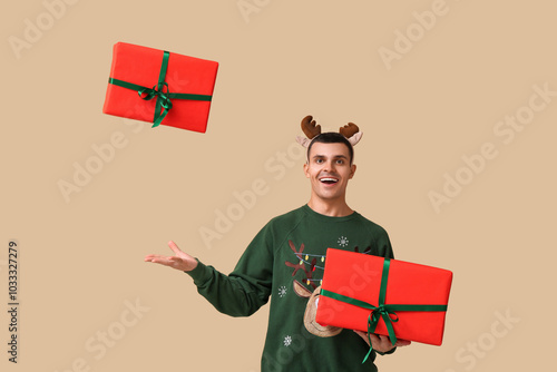 Happy young man in reindeer...