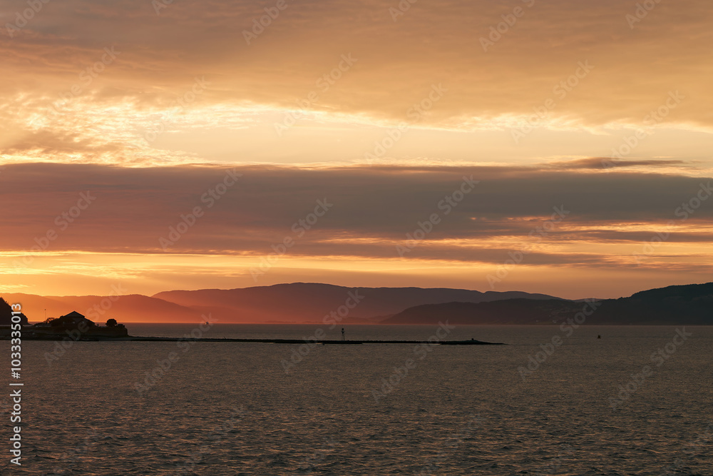 Stunning sunset over Trondheim fjord scene Stunning sunset over Trondheim fjord scene