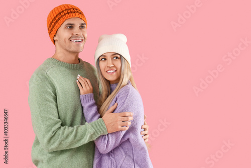 Happy young couple in winte...