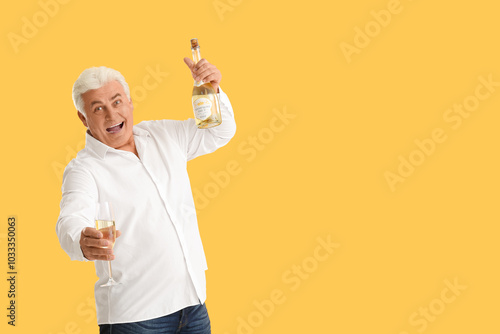 Happy senior man with bottl...