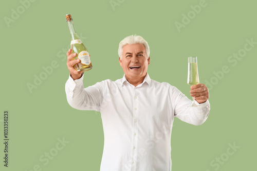Happy senior man with bottl...