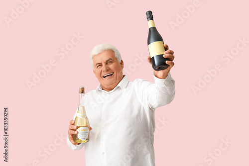 Happy senior man holding sp...