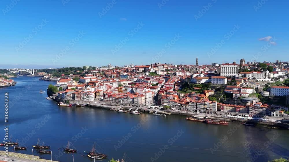 Porto, Portugal. Aerial view of the old city with promenade of the Douro river and old bridge. Porto, Portugal. Aerial view of the old city with promenade of the Douro river and old bridge.