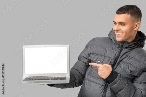 Young man in stylish puffer...