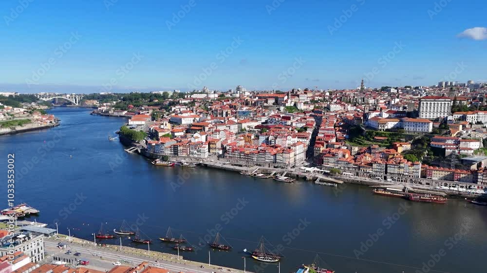 Porto, Portugal. Aerial view of the old city with promenade of the Douro river and old bridge. Porto, Portugal. Aerial view of the old city with promenade of the Douro river and old bridge.