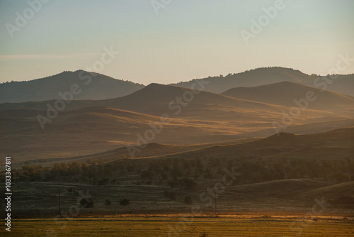 Golden dawn with Tupan in the hills photo